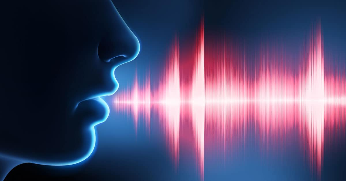 Silueta de una cara con frecuencia de voz.