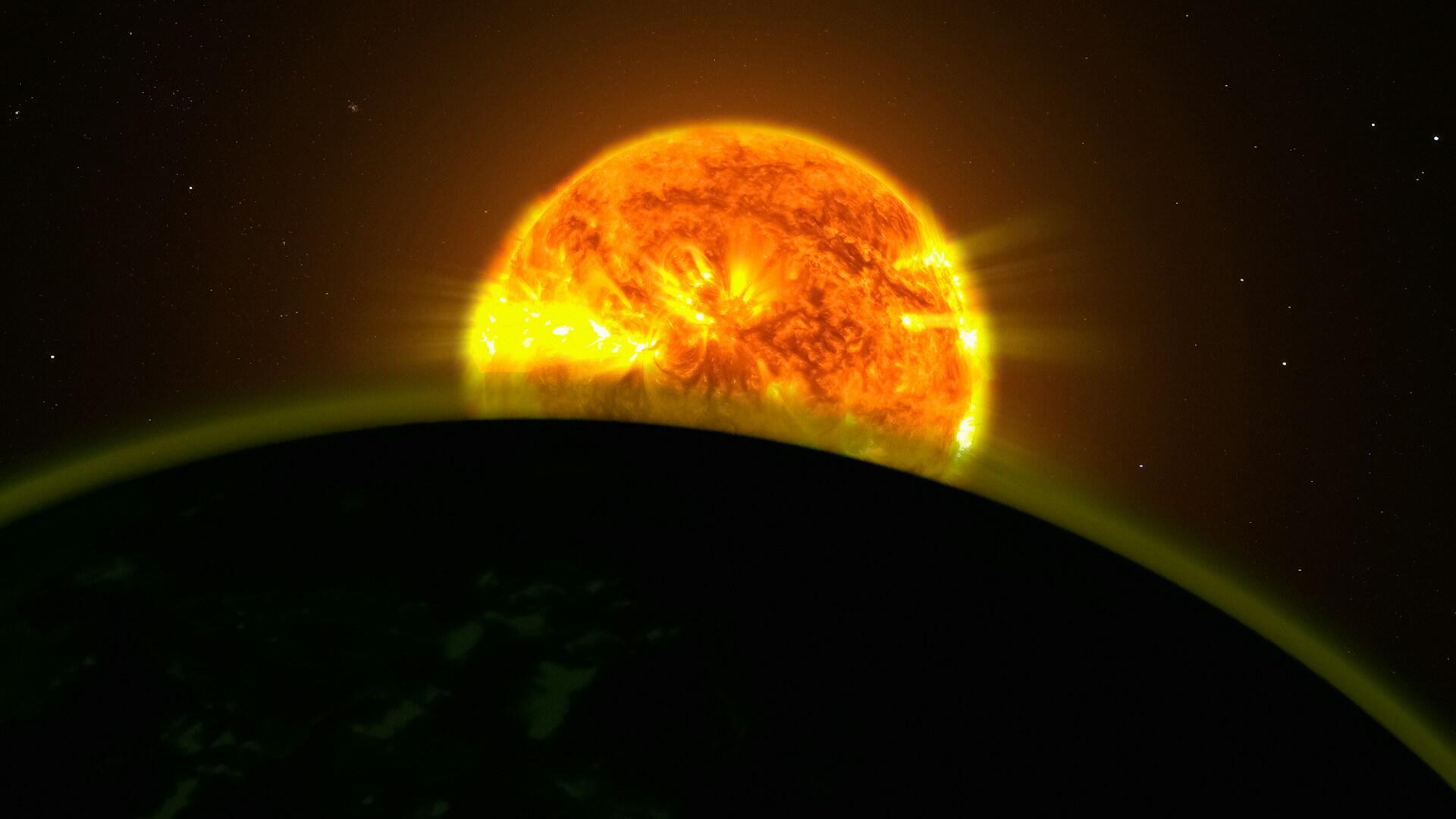 Bild der Sonne vor einem Planeten.