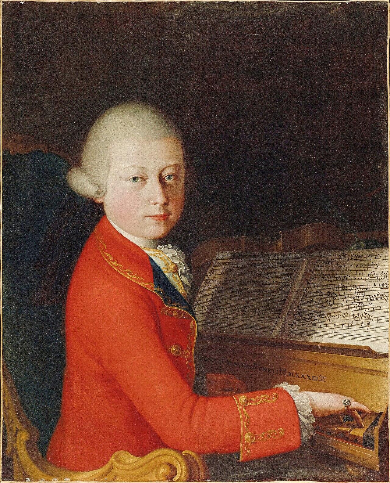 Noor Wolfgang Amadeus Mozart punases kuues istub klahvpilli taga, tema ees on avatud noodiraamat.