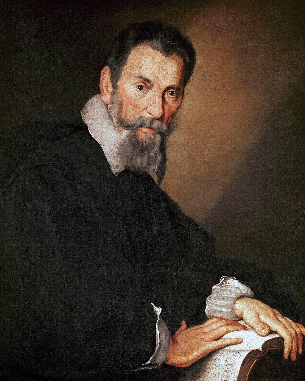 Retrato de un Monteverdi barbudo vestido con ropa del siglo XVII, con expresión contemplativa. Apoya las manos sobre un libro, sobre un fondo oscuro y sutil.