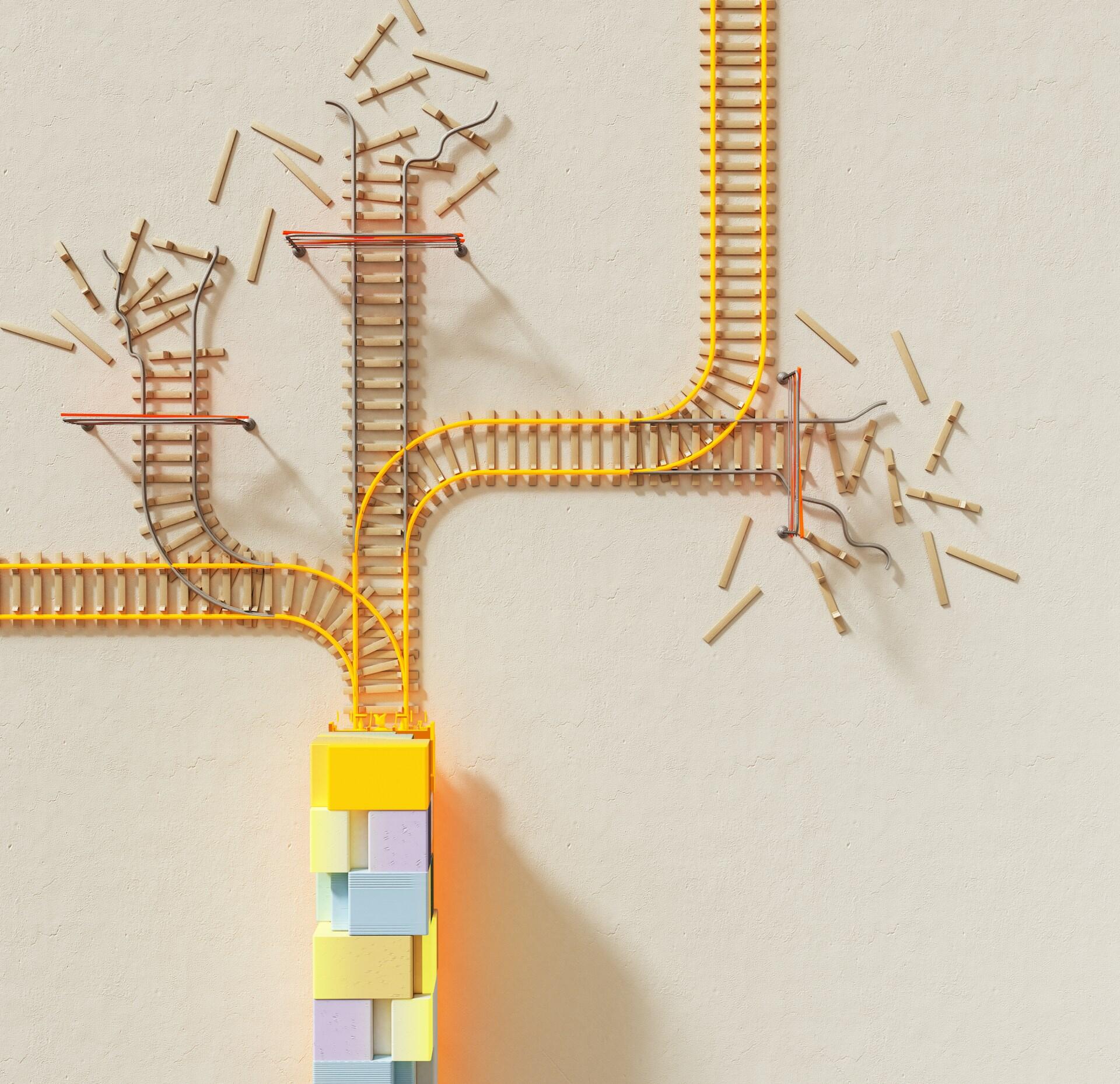Una vía de tren en miniatura con ramificaciones atraviesa una superficie pálida, con trozos de vía rotos esparcidos y un colorido tren de vagones por debajo, lo que evoca un recorrido interrumpido.
