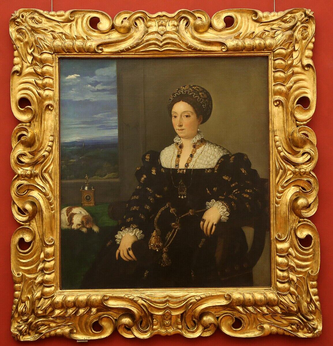 una mujer elegantemente vestida con un traje negro de corte renacentista, adornado con bordados dorados y joyas.