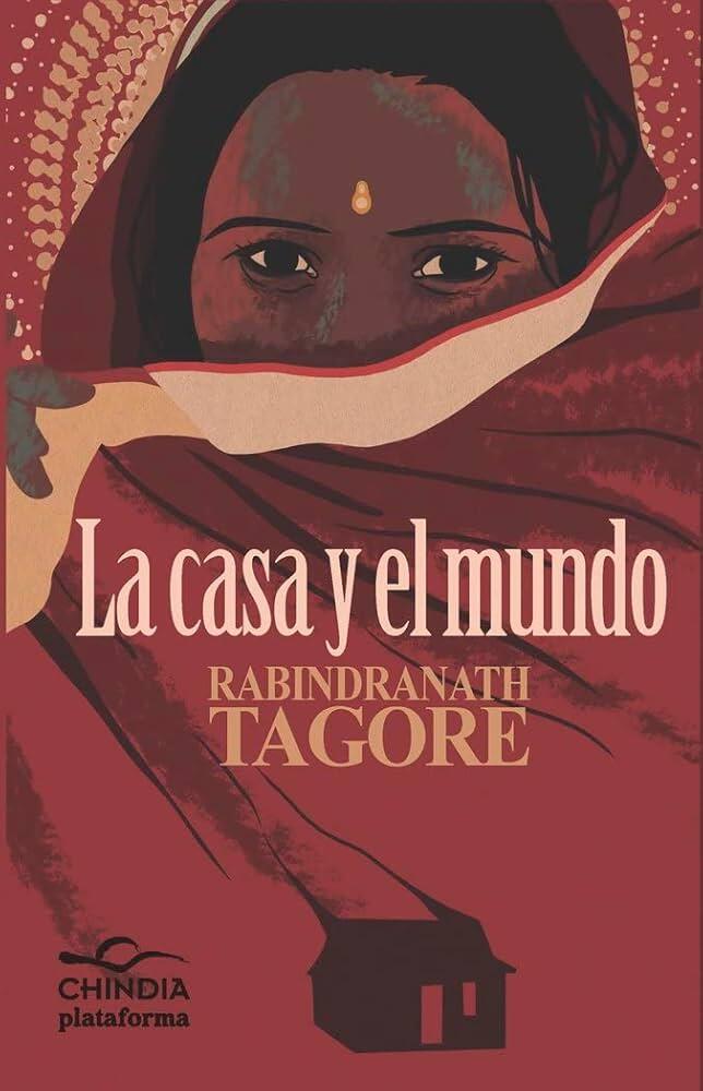 Una mujer de ojos oscuros y sari rojo mira fijamente bajo el texto «La casa y el mundo», de Rabindranath Tagore. Los tonos cálidos y terrosos predominan en la portada.