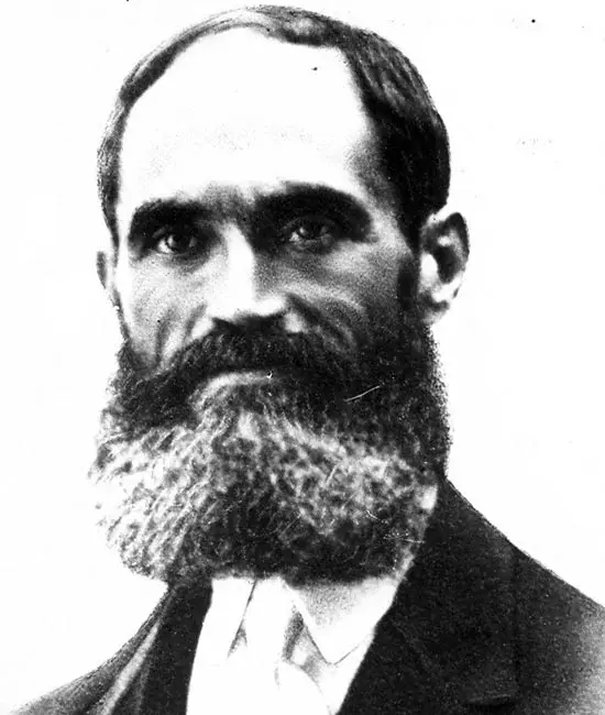 Retrato de época de juan padros, fundador del madrid un hombre con barba poblada, vestido con traje formal y corbata, sobre un fondo liso.