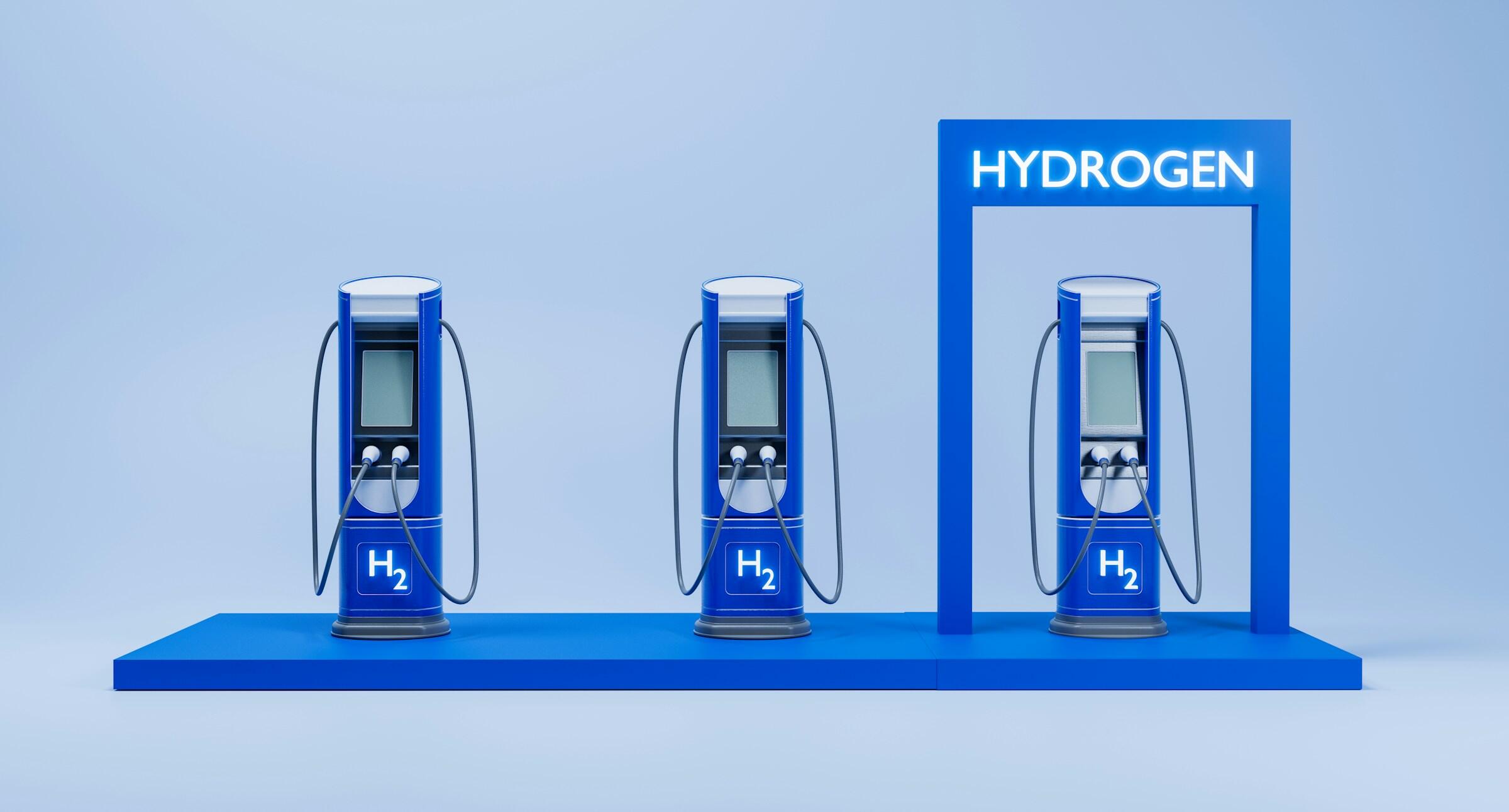 Tres surtidores de hidrógeno azul sobre una elegante plataforma, iluminados por un letrero azul con la palabra «HYDROGEN» en un entorno minimalista.