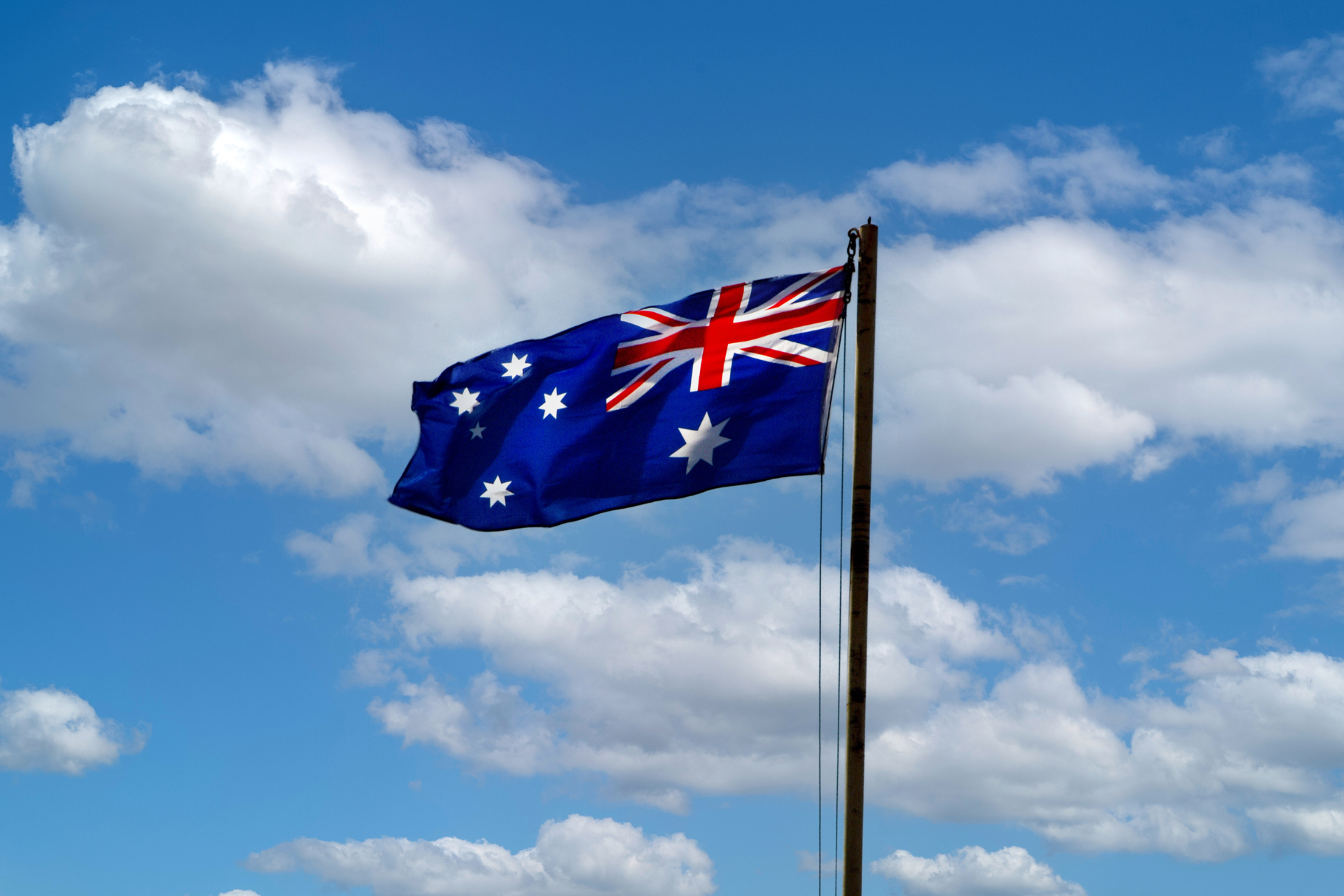 Bandera de Australia con un fondo azul, el Union Jack en la parte superior izquierda y seis estrellas en el lado derecho.