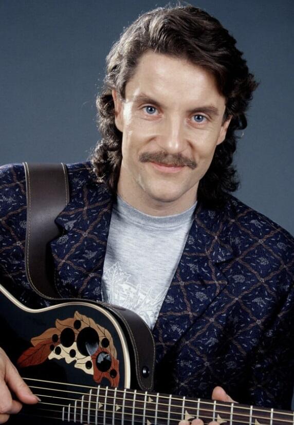 Francis Cabrel avec sa guitare