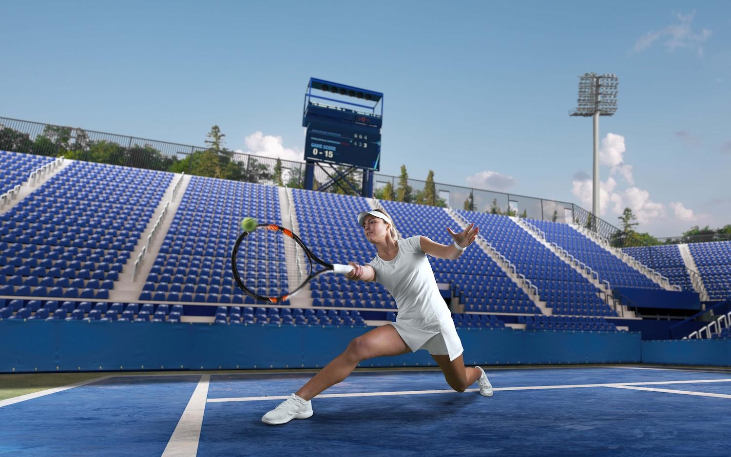 Une joueuse de tennis est en train de taper dans la balle.