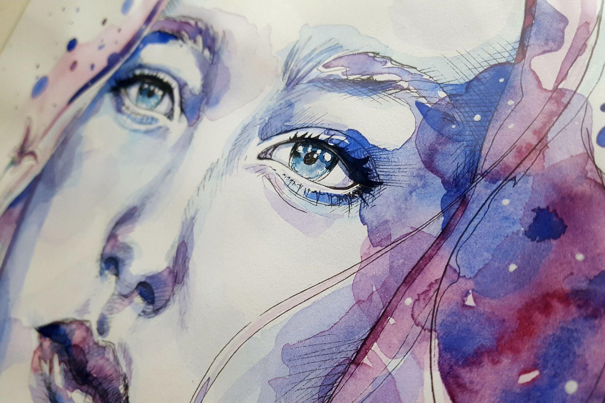 Un visage de femme peint à l'aquarelle.