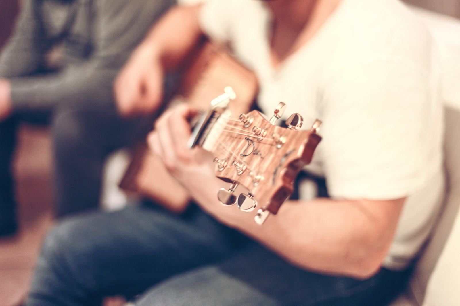 A man plays guitar