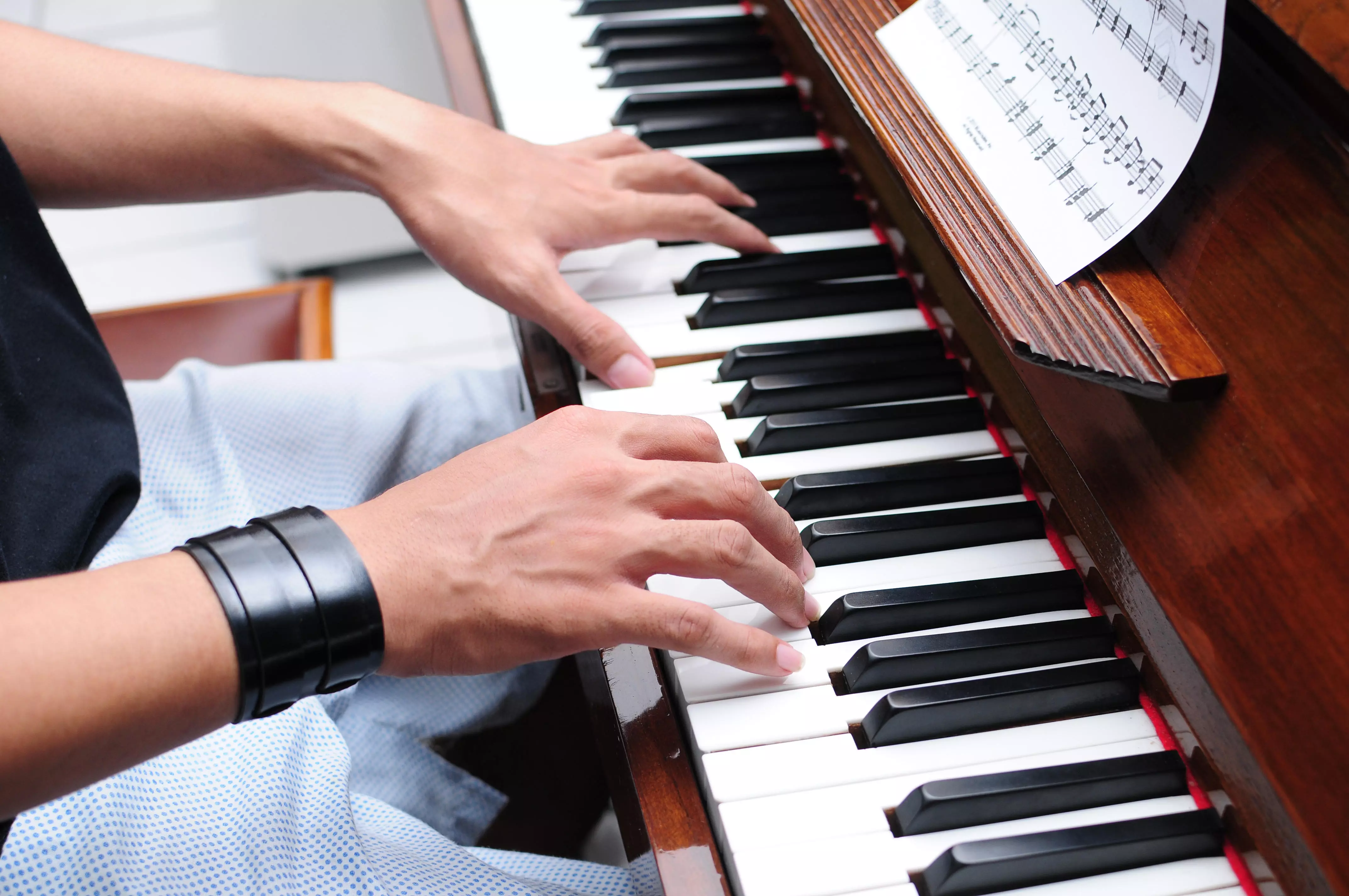 Man learning piano