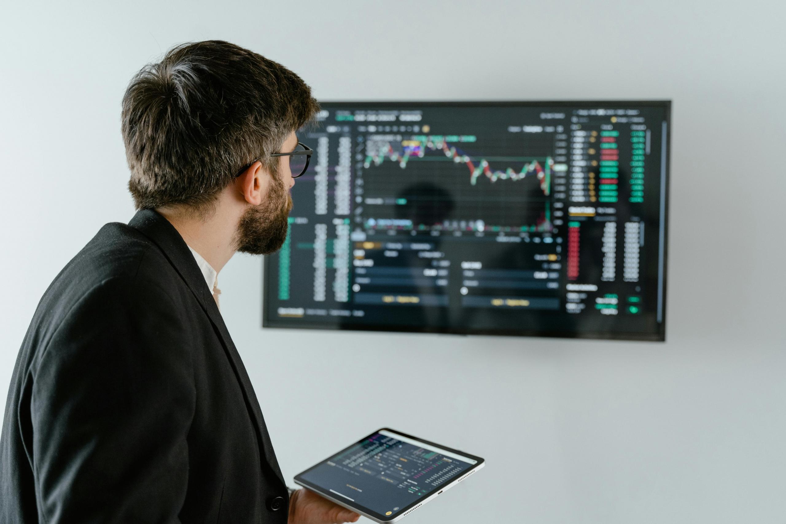 A man analysing data on the board