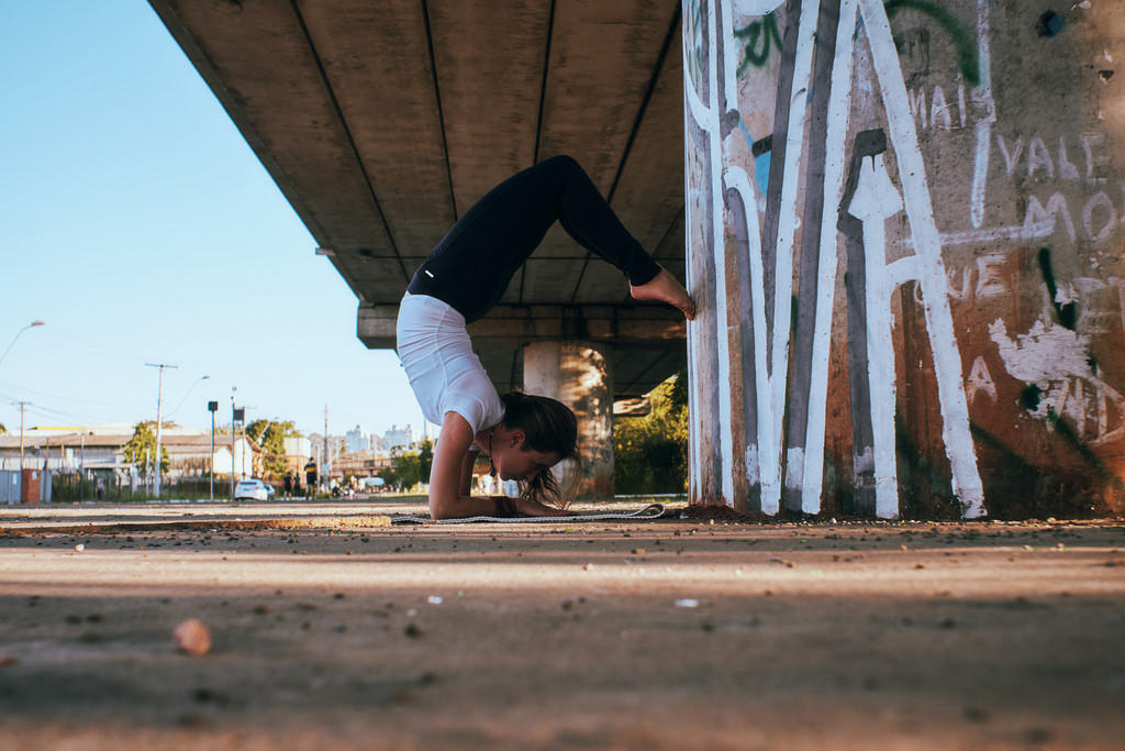 Feel better connected to your surroundings by doing yoga outdoors.