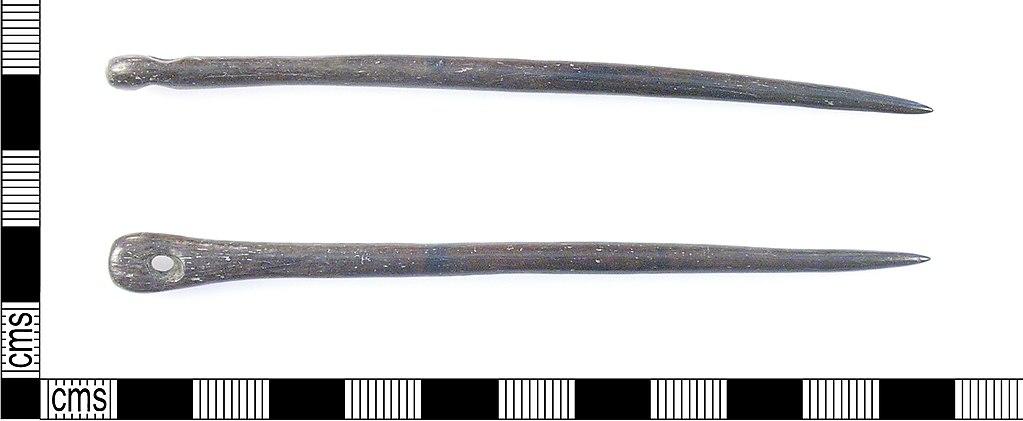 Examples of primitive sewing needles, made of bone