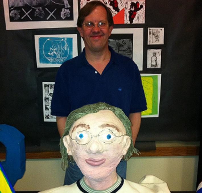Is this teacher's likeness a cartoon or caricature?