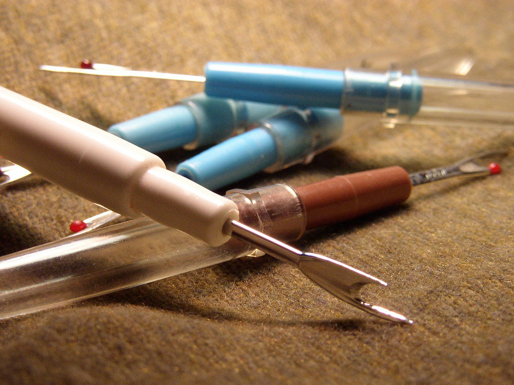 Seam rippers will undo your stitching.