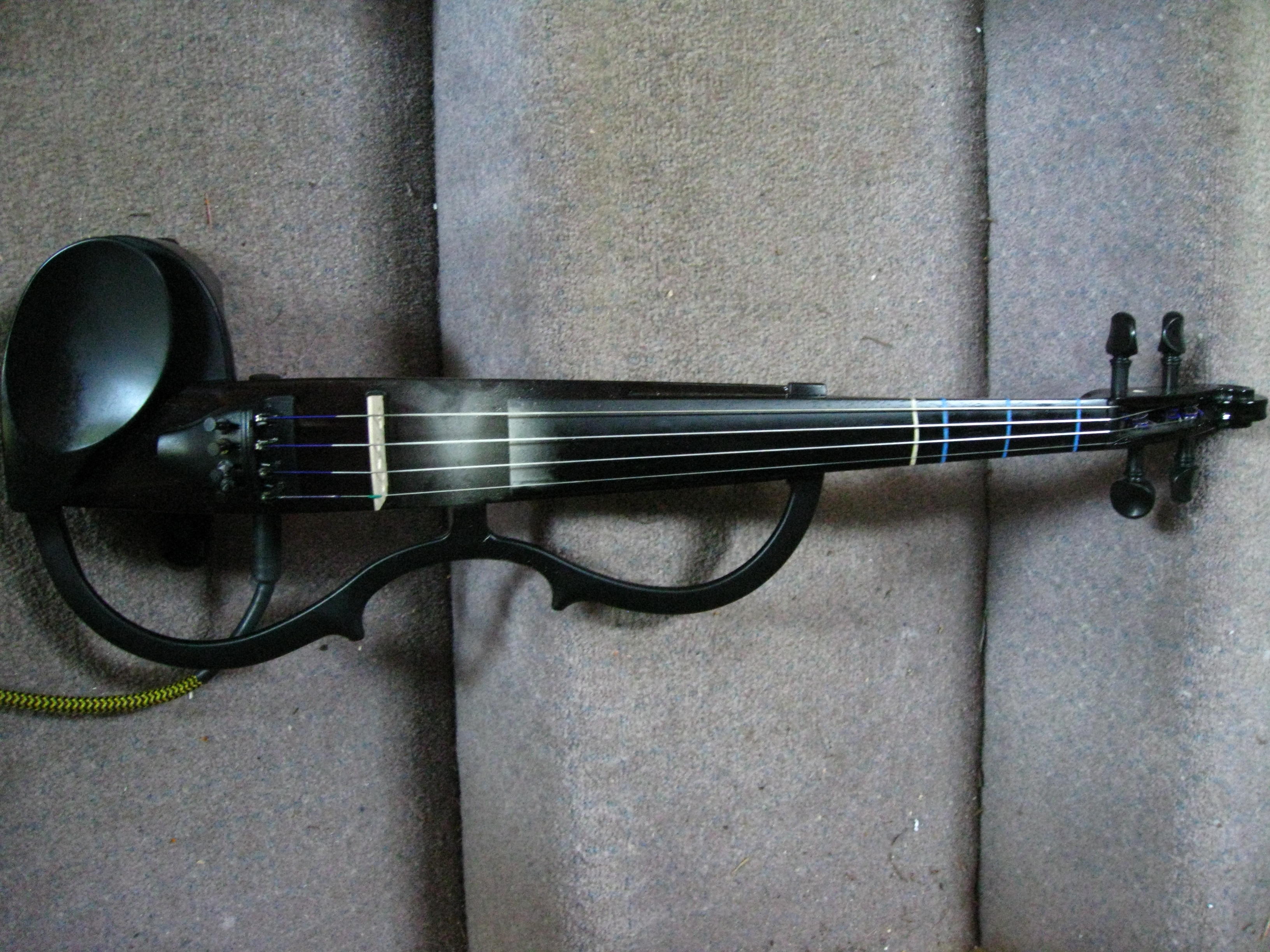 How can you learn to play an electric violin?