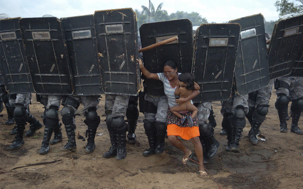 Woman Resists Eviction in Manaus by Luiz Vasconcelos