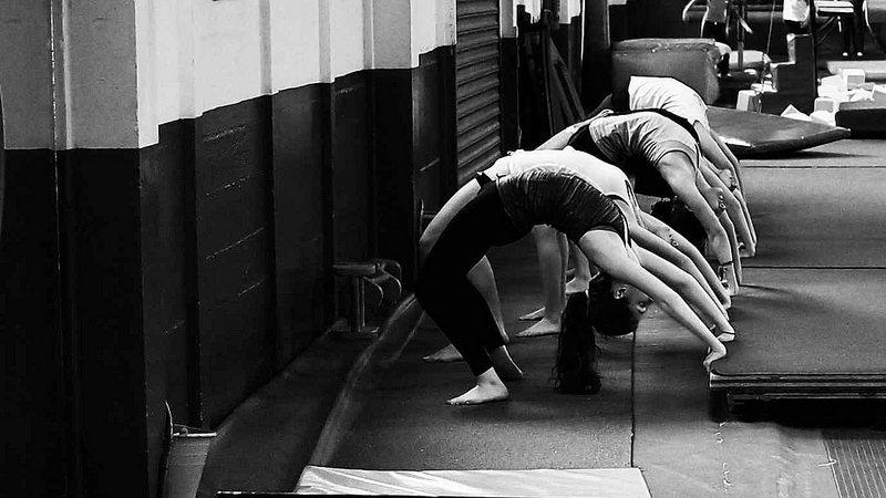Become more flexible by doing stretching exercises before dance class.