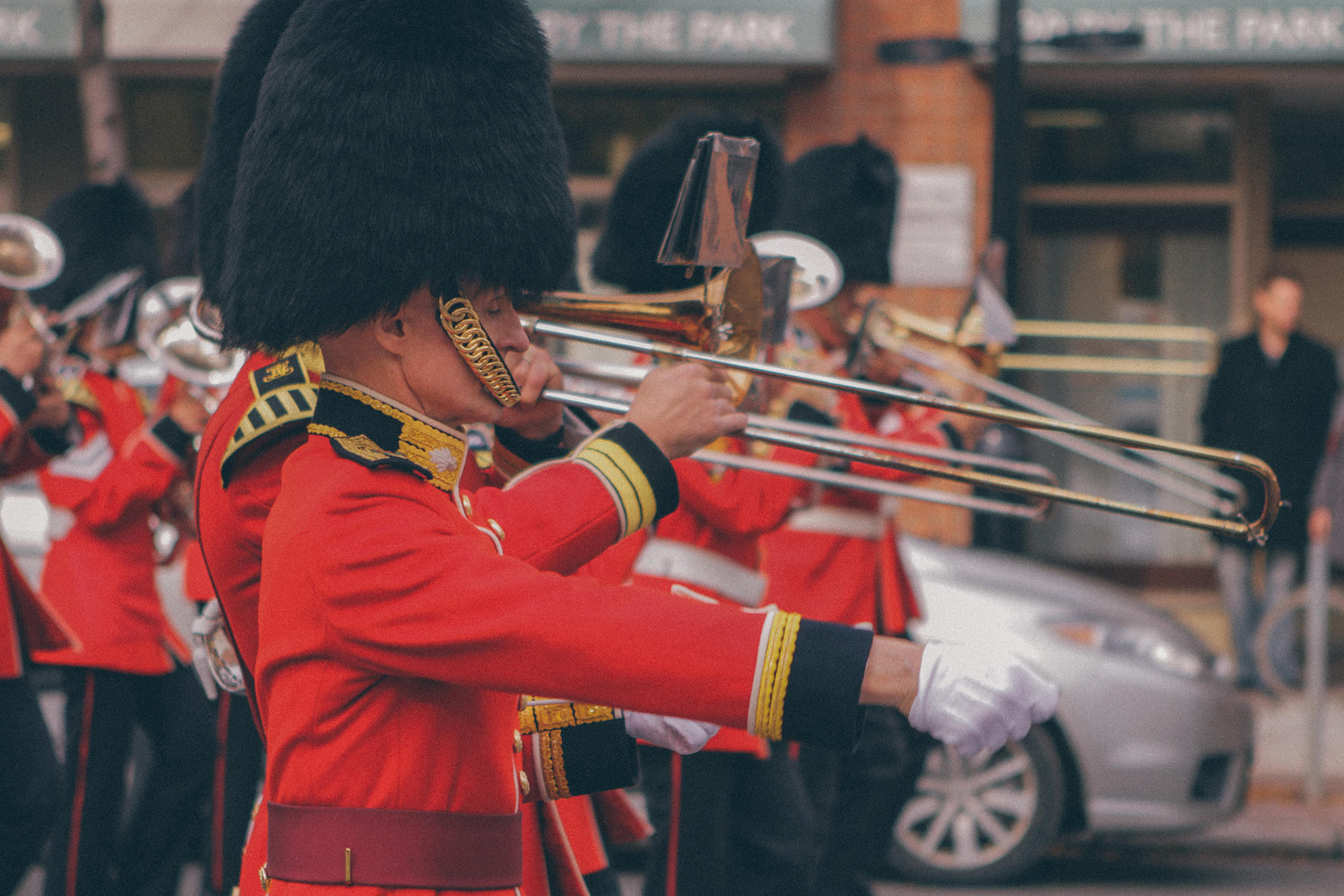 Marching band acts out a scene in London.