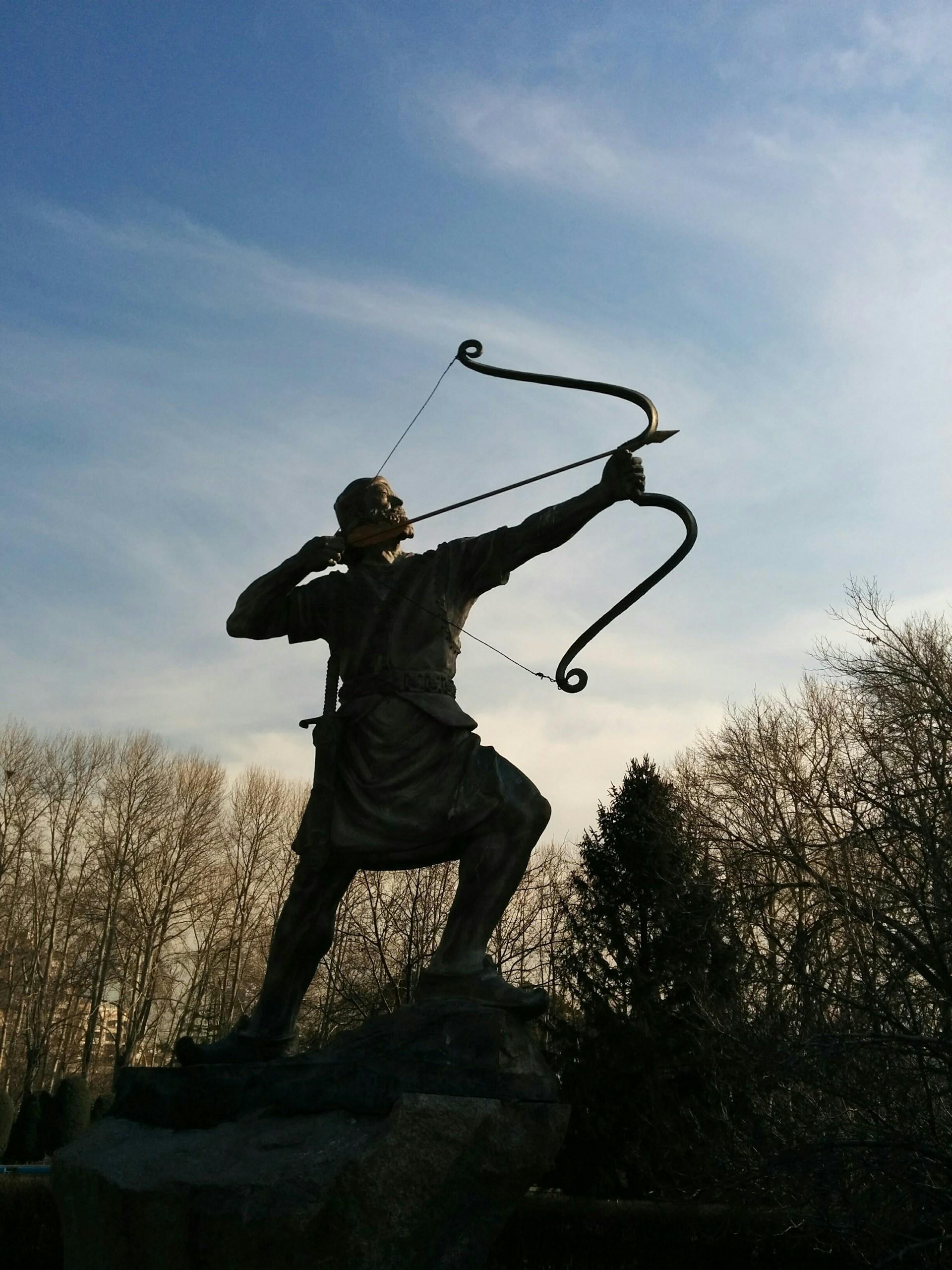 person holding an English longbow