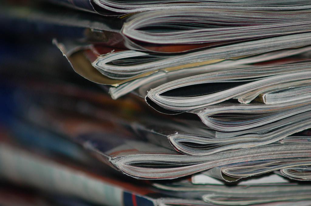 A pile of magazines. Magazines can be a great source of economic news.