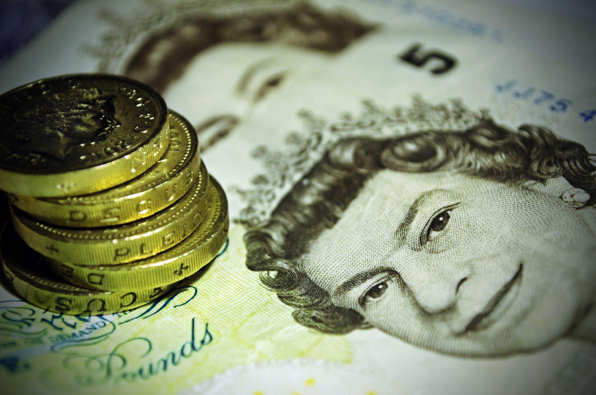 Pounds and notes. You need to consider the cost of an economics teacher before hiring one.