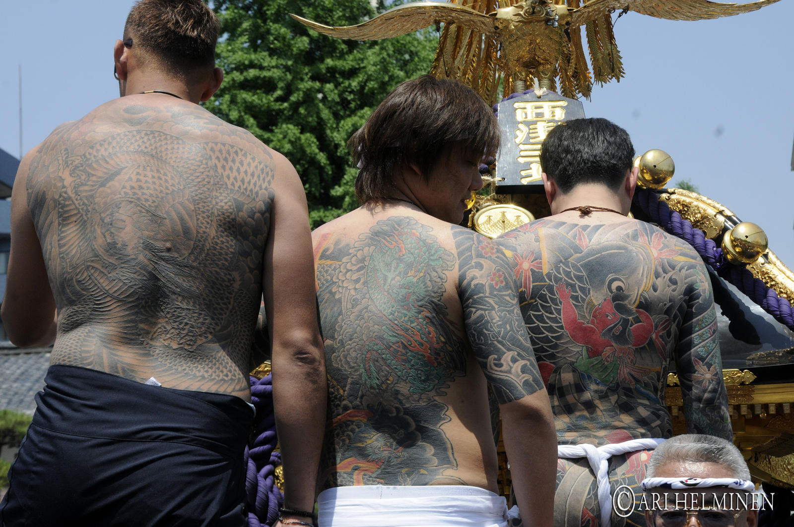 Japanese Yakuza showing their tattoos