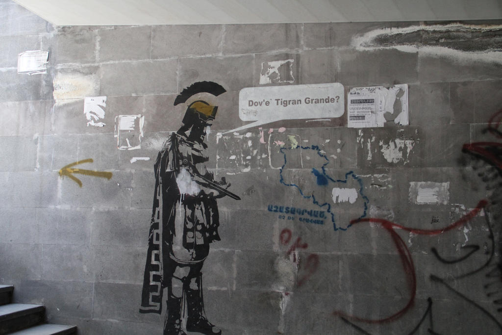 Roman centurion graffiti on wall.
