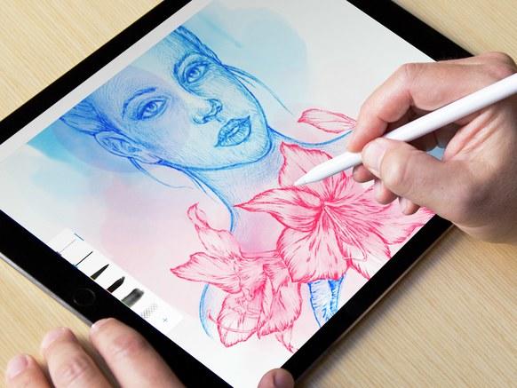 Drawing on a tablet.