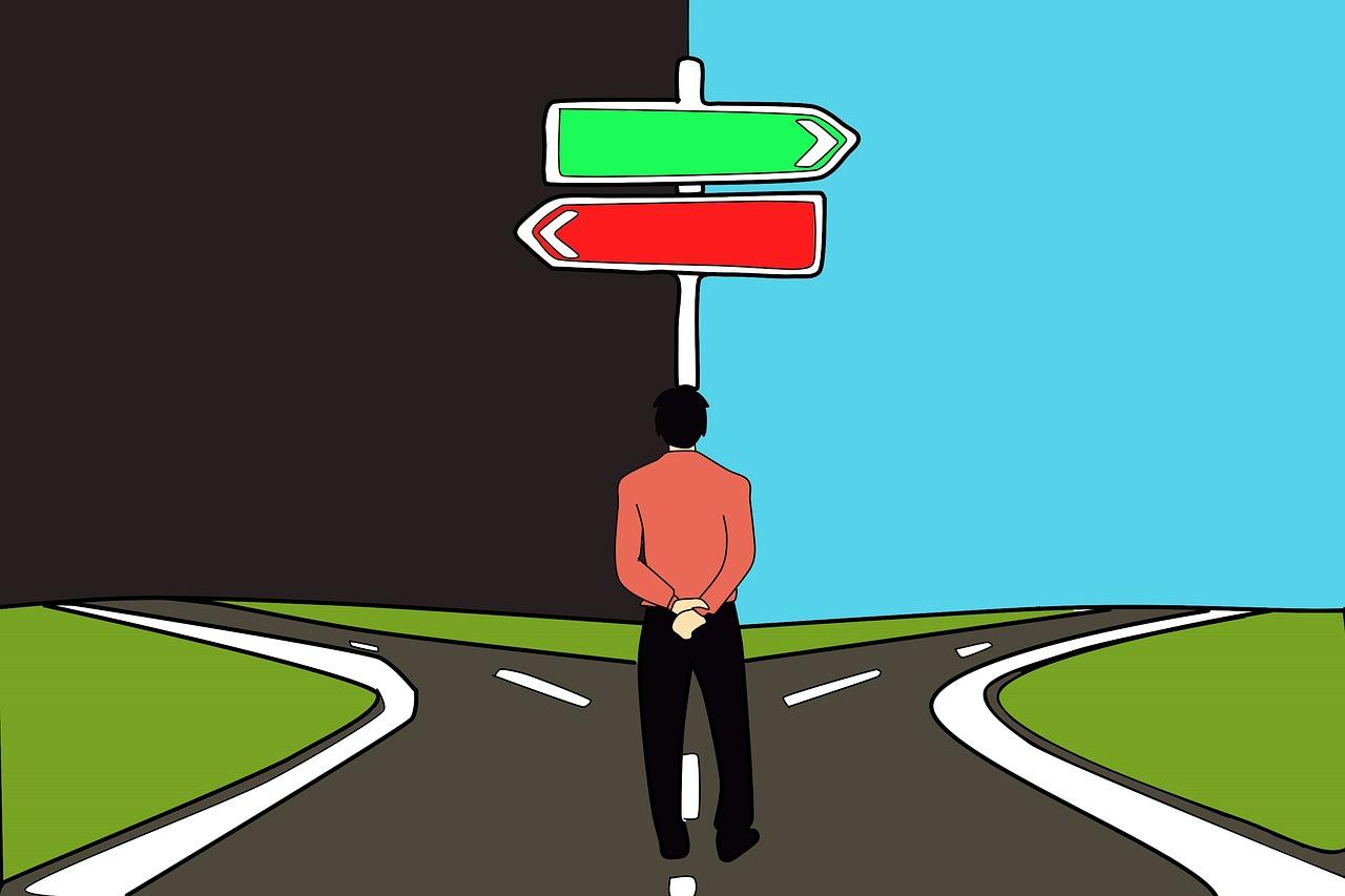 A man standing at a crossroads deciding whether to go left or right. Is it possible to change the economics syllabus?