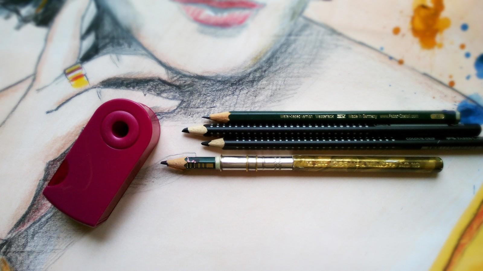 Drawing with pencils.