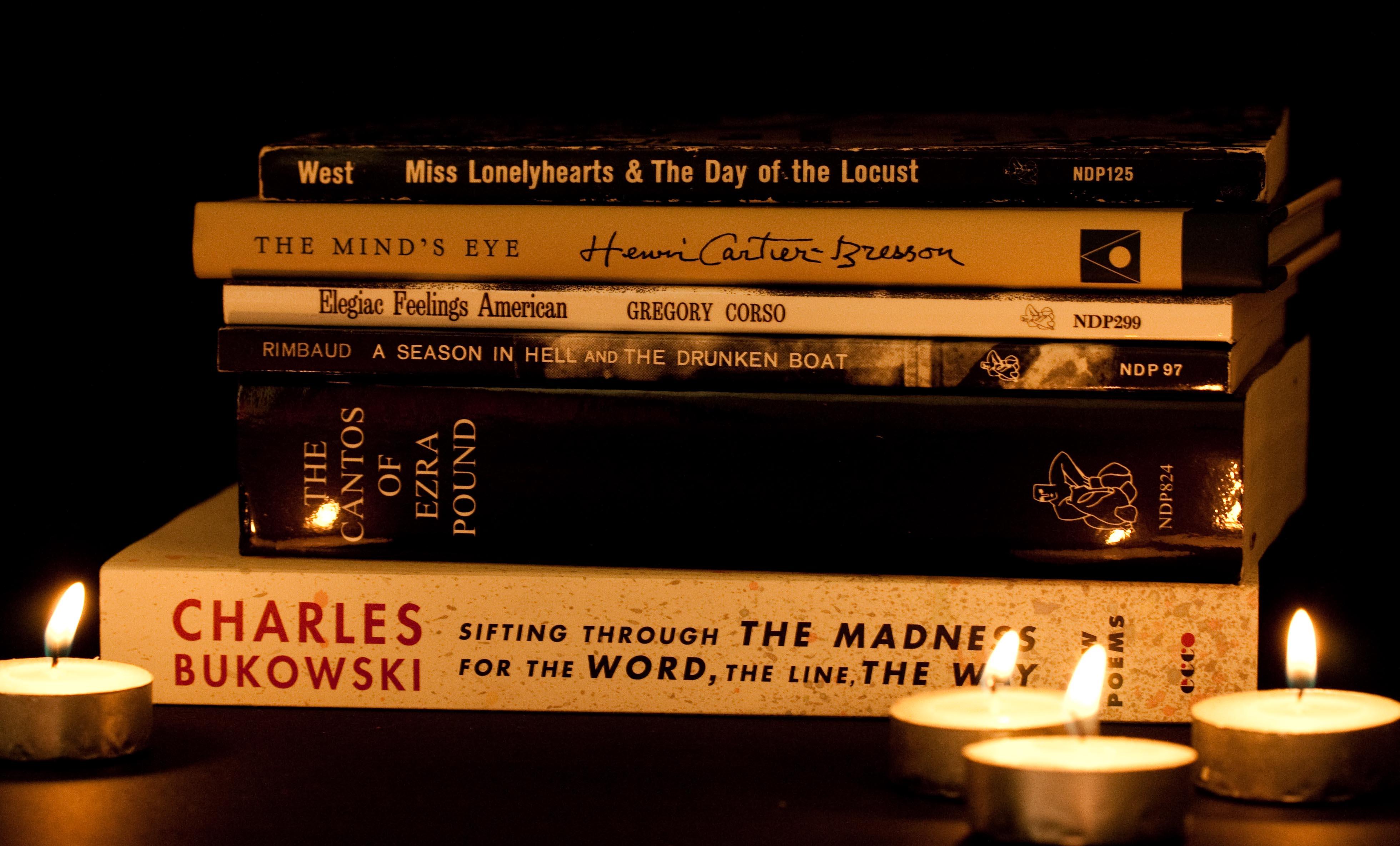 Poetry books on night stand.