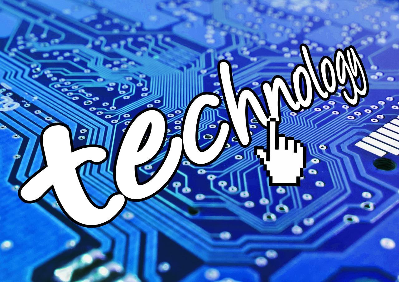 The word technology written across a blue computer chip background.