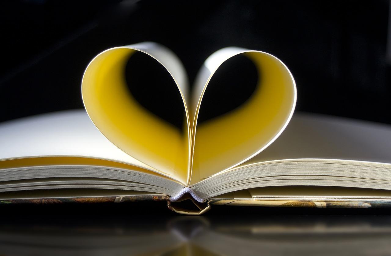 A book with two pages folded to form a heart shape. Poems for children can be enriching and entertaining to read