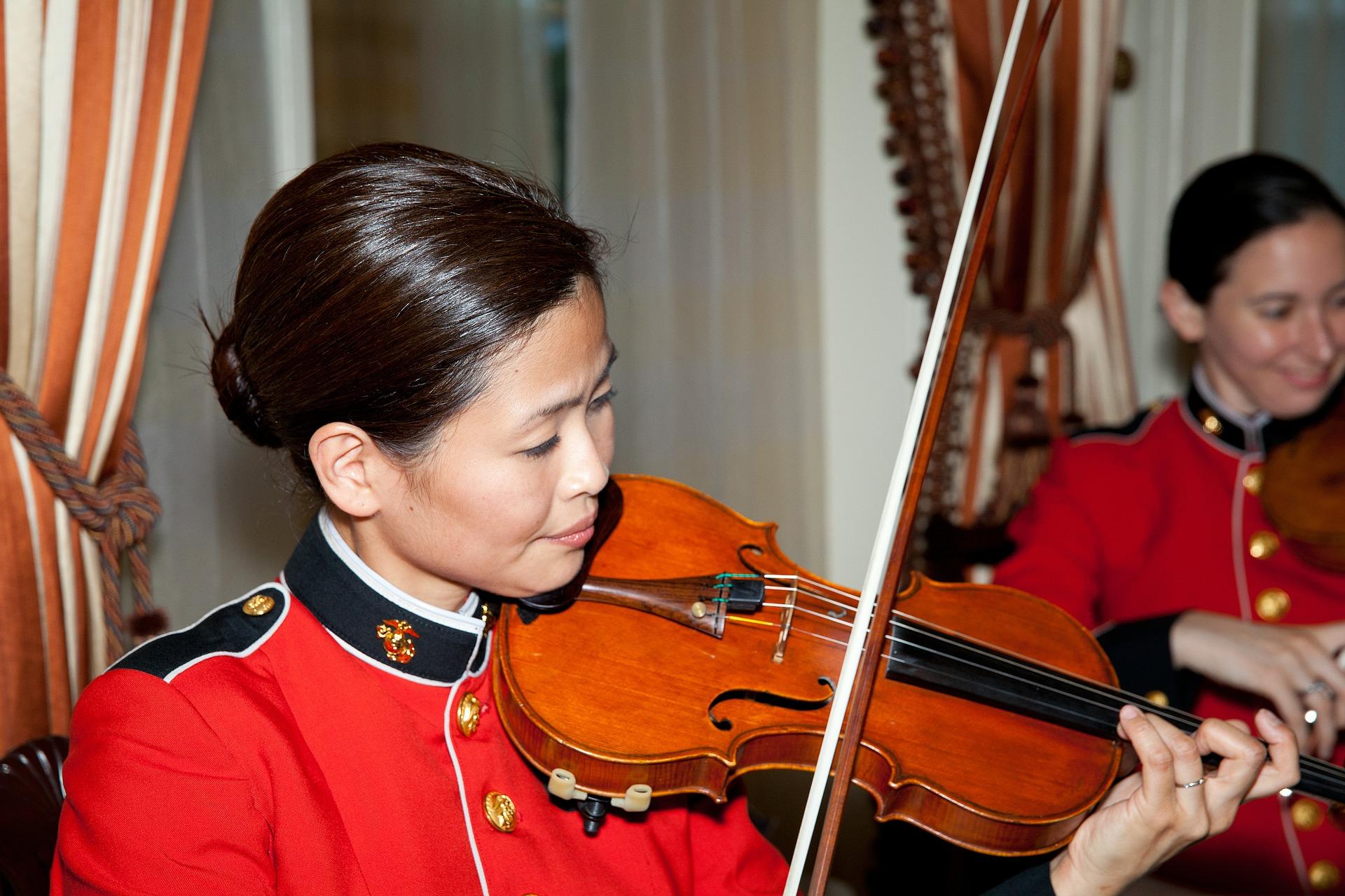How is the violin played in Asia?