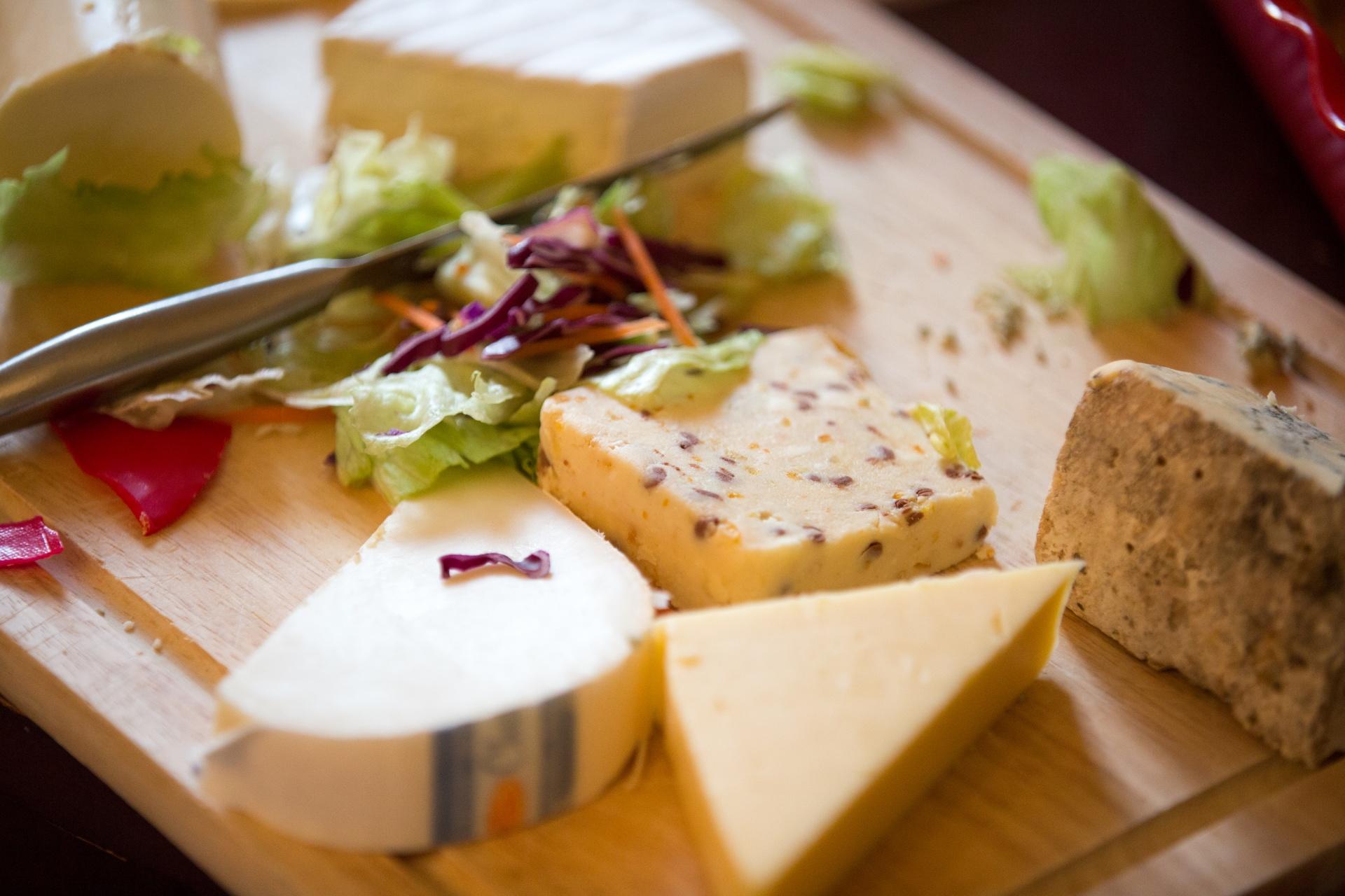 A cheeseboard with various cheeses. Some cheeses aren't recommended in pregnancy diets.