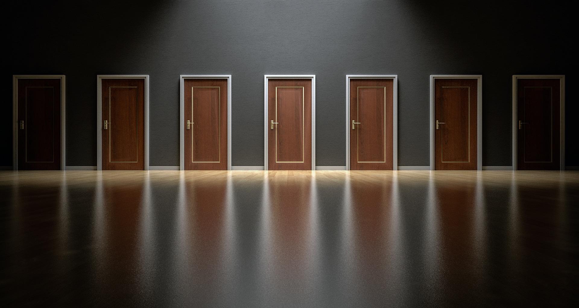 A row of closed doors. Choosing between accounting exams can be difficult.