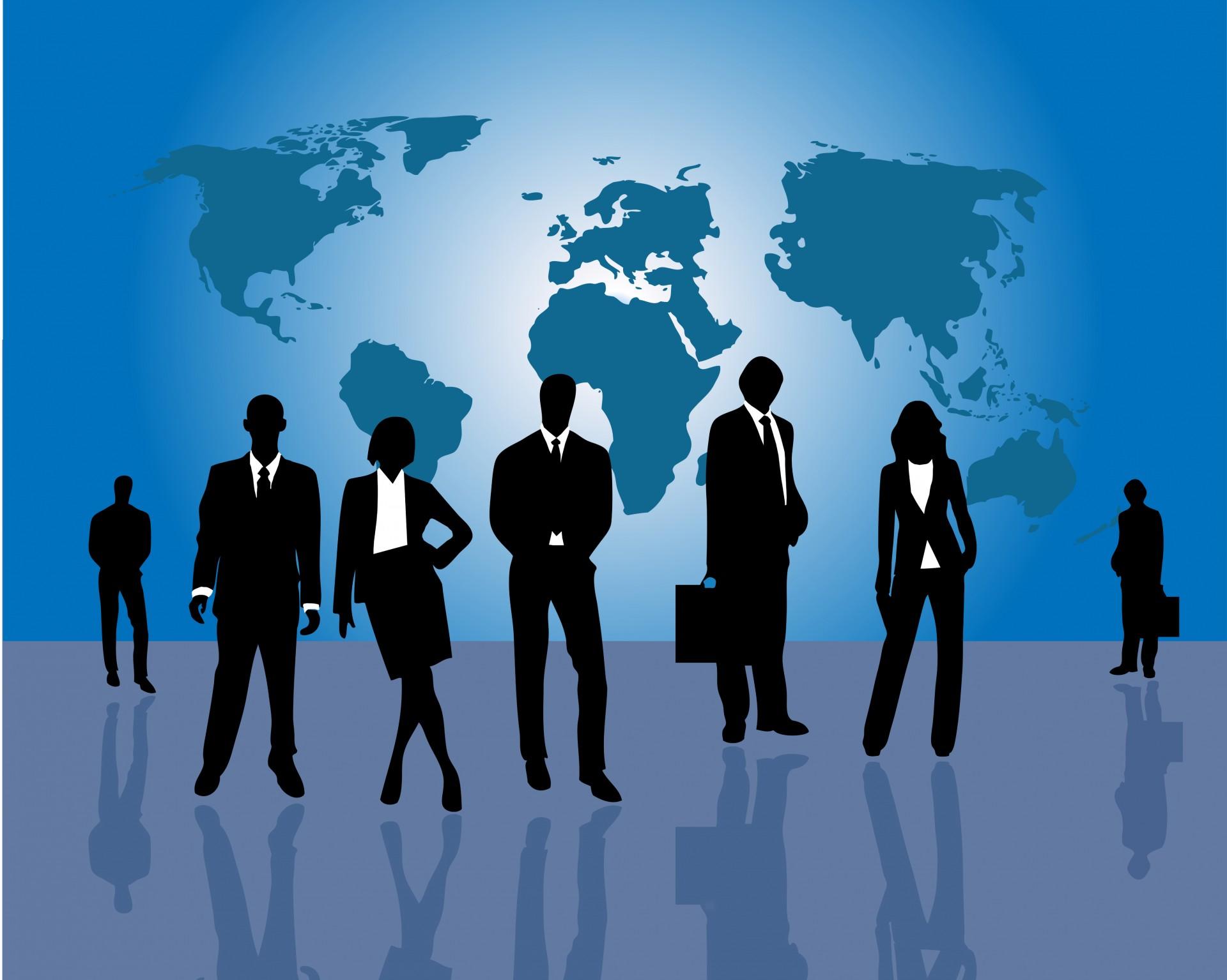 Silhouettes of businessmen and businesswomen with a map of the world in the background. Learning Hindi can give you a headstart in business.