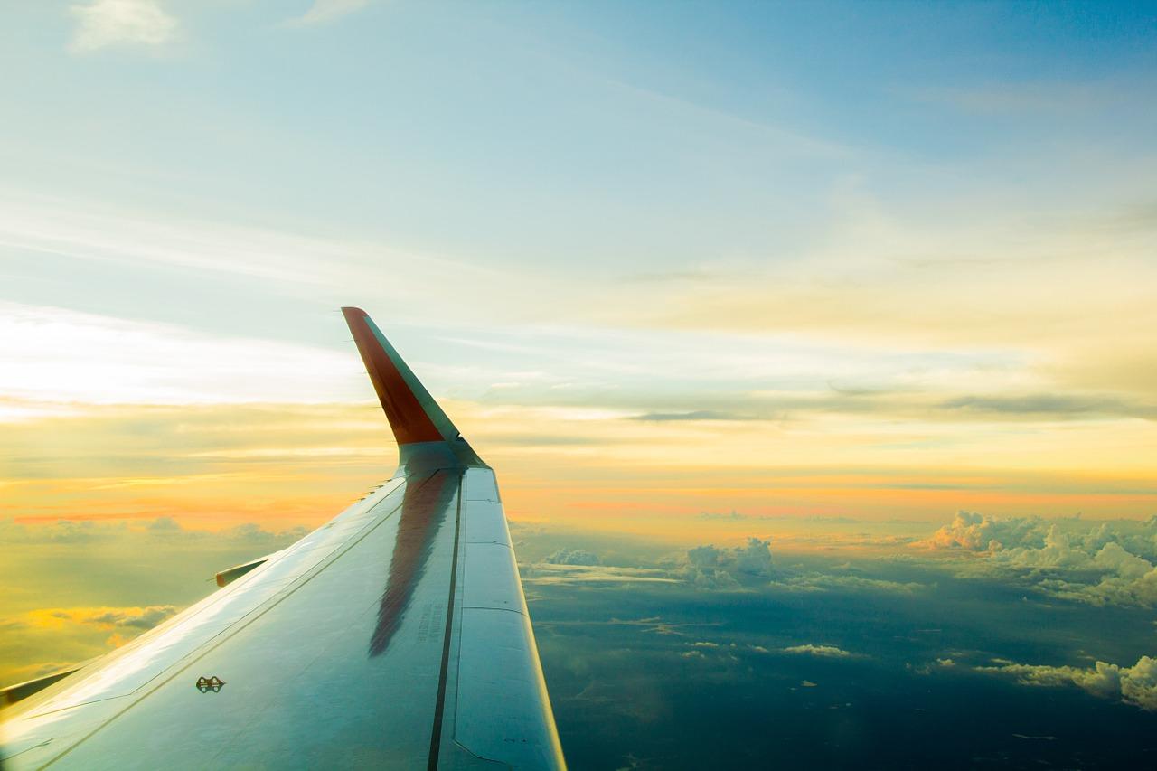 An image of a plane in the air. The Hindi language can be useful when travelling.
