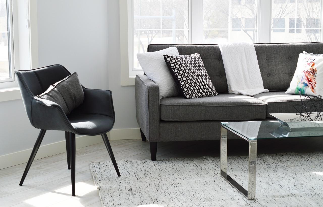 An image of a living room with a sofa, chair, and table. Chemistry for kids doesn't have to be boring when you help them learn at home.