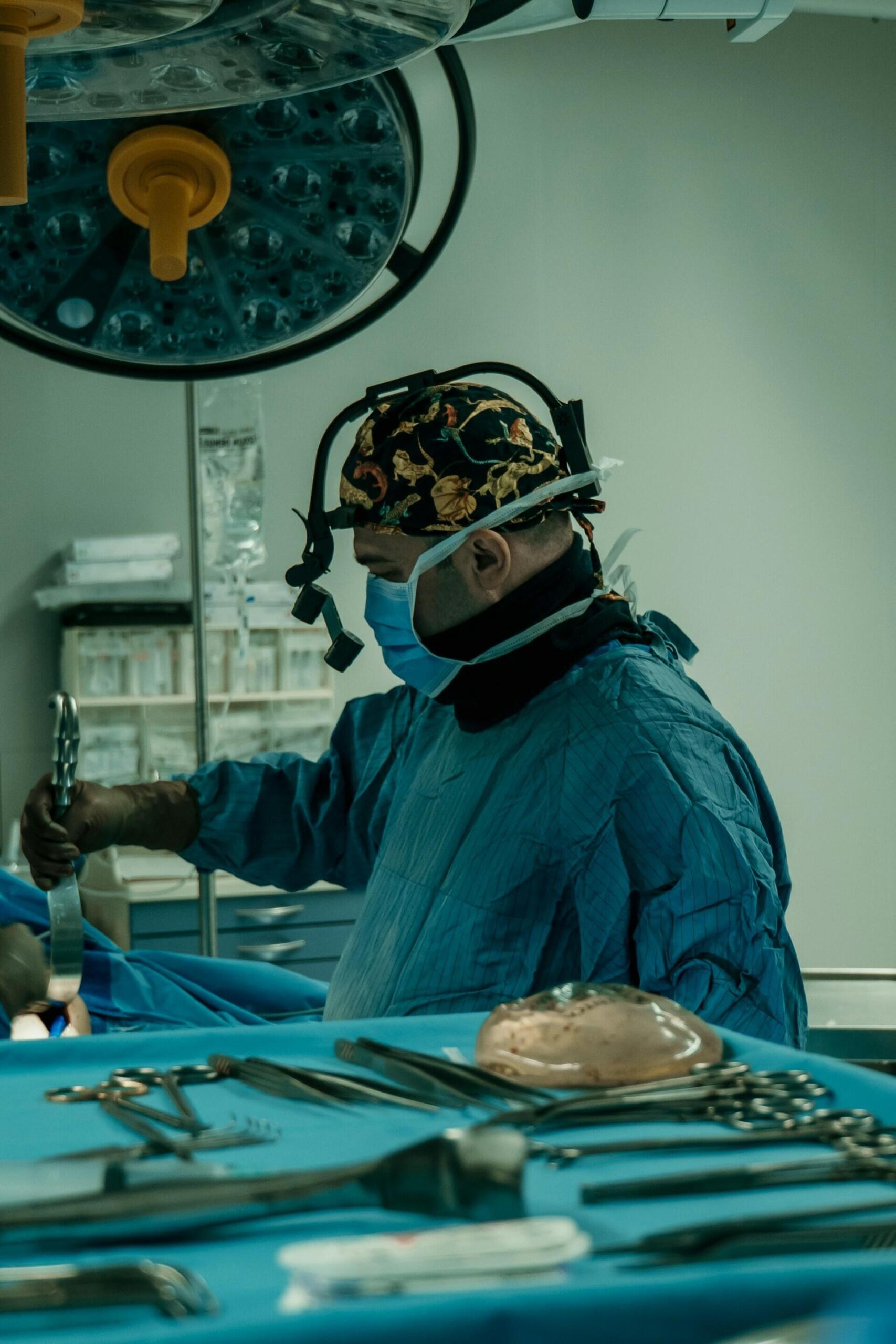A person in surgery scrubs in an operating theatre.