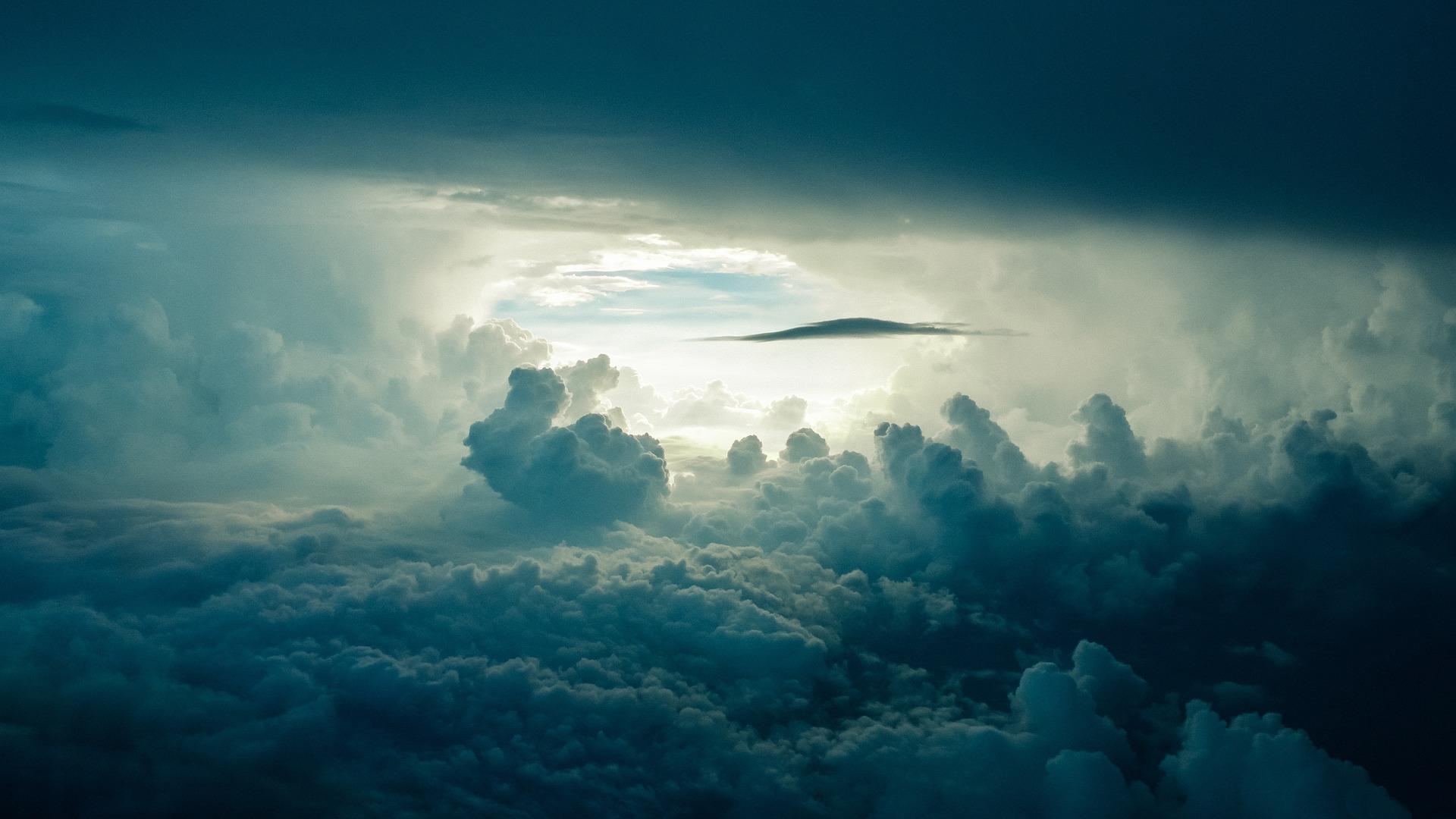 A picture of clouds with some sunlight peering through. The atmosphere is one of many topics that could be included in a GCSE chemistry syllabus.