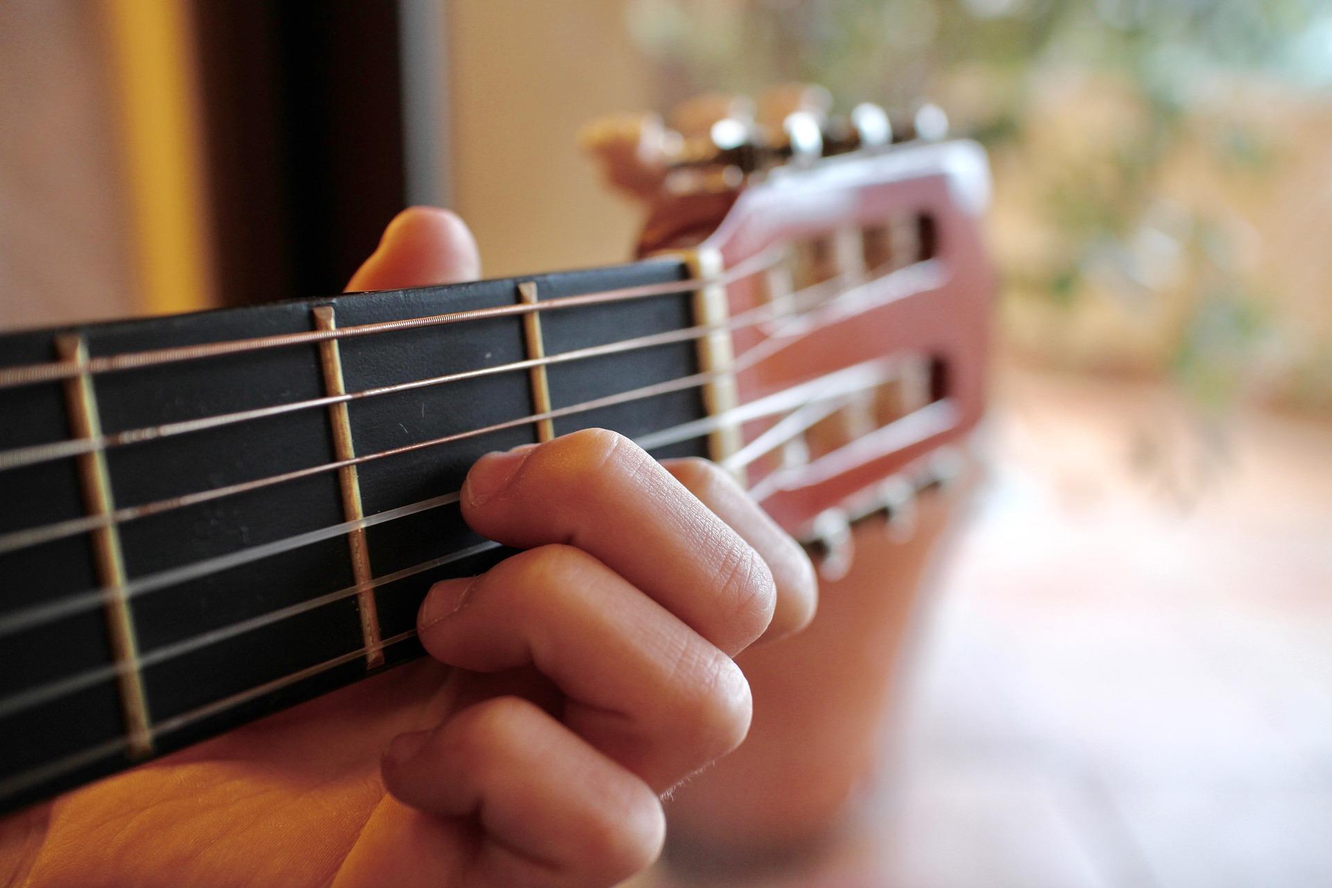 What are the benefits of playing guitar?