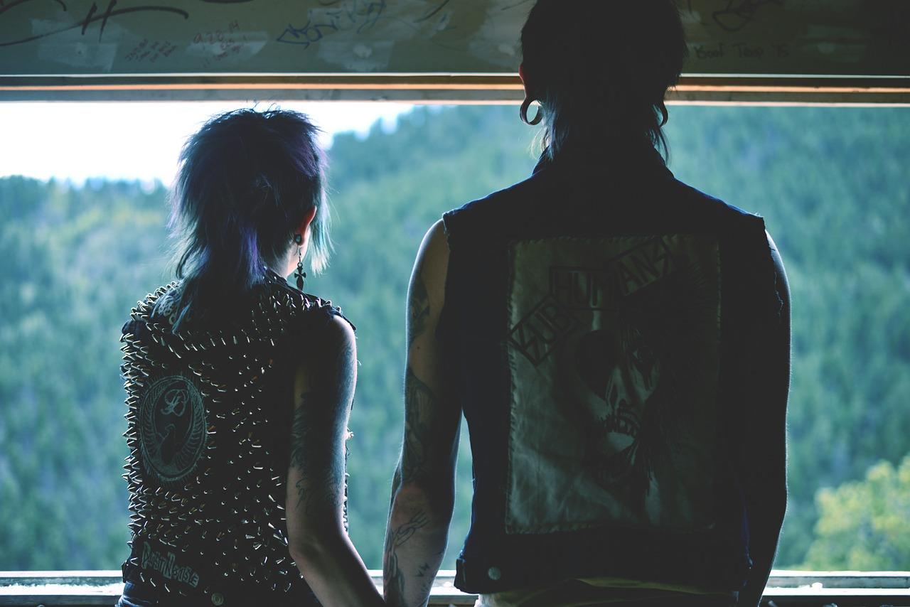 Two rockers looking outwards hand in hand. Rock n roll drums are well-suited to drummers that want to play rock music.