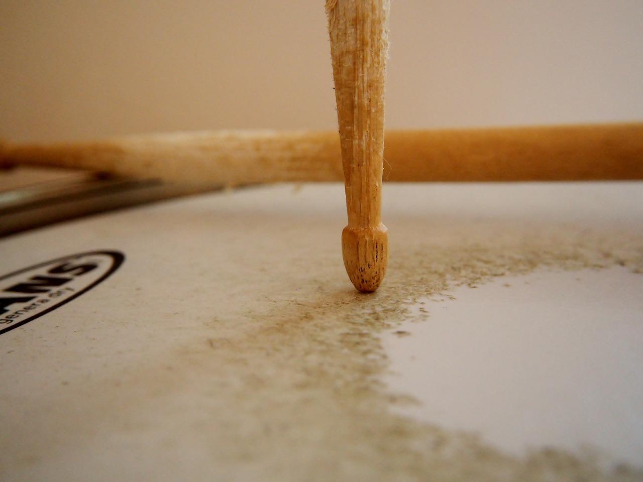 Drumsticks on top of a snare drum.