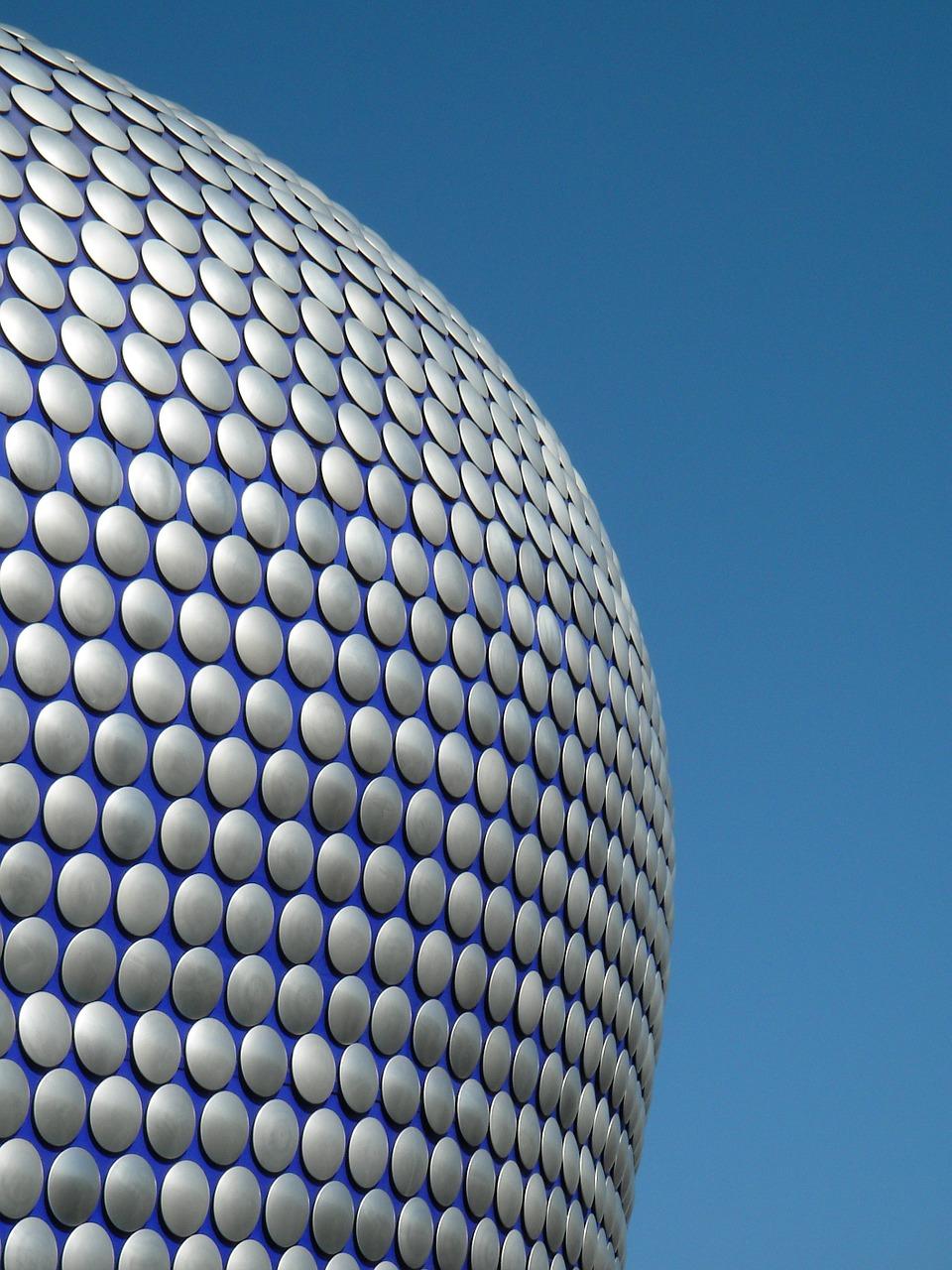 Birmingham's Bullring, against blue sky.
