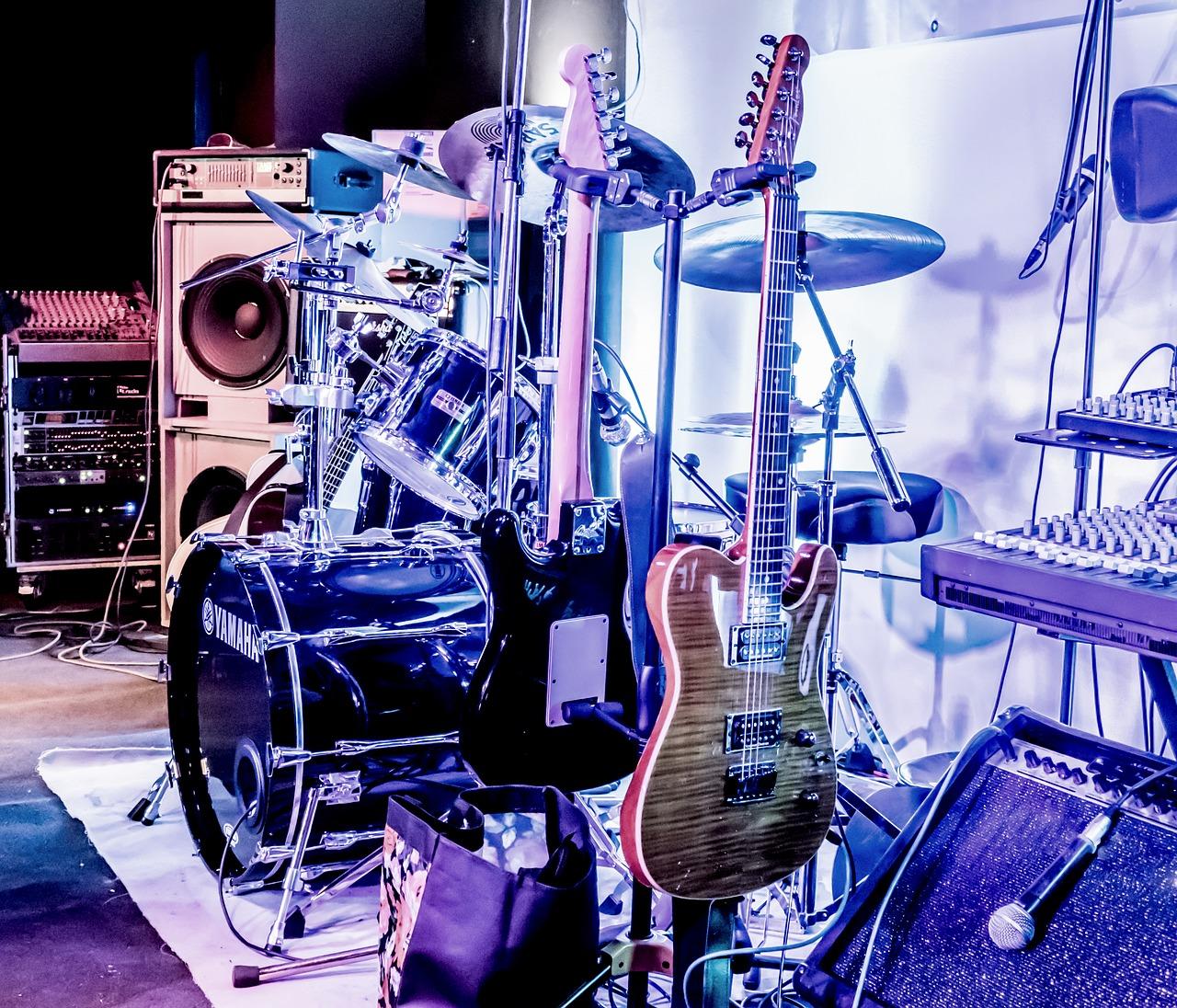 Guitars on stage with a drum kit