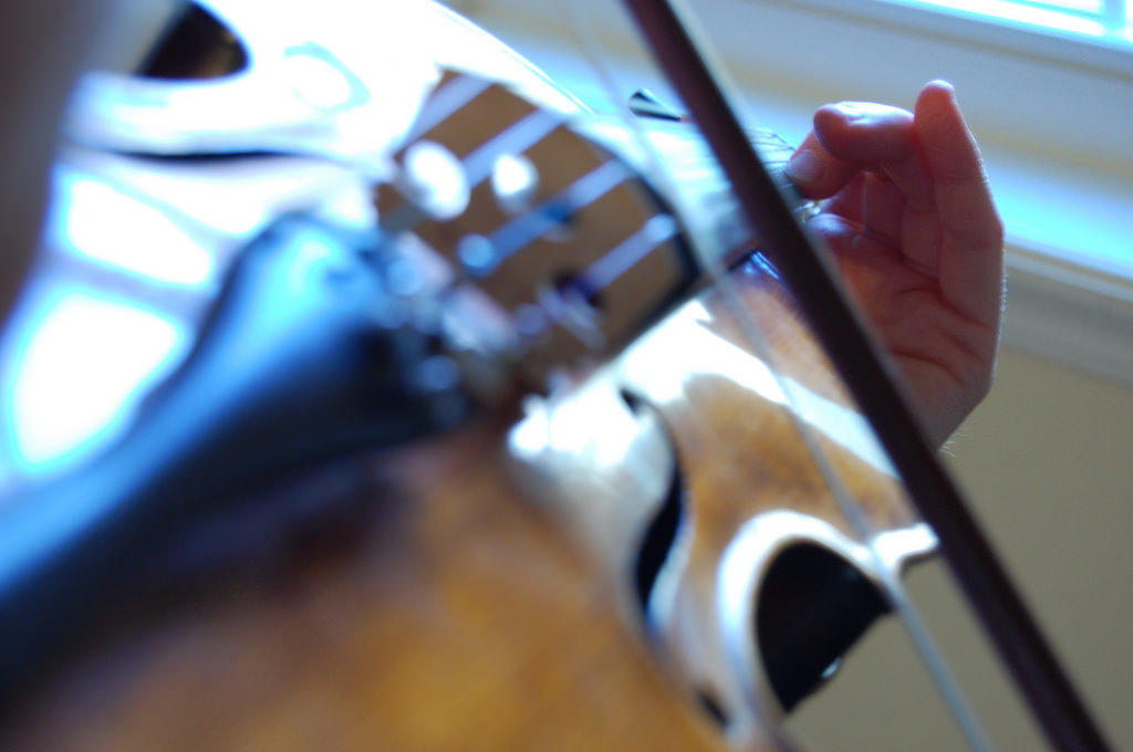 Playing violin isn't easy so practice makes perfect.