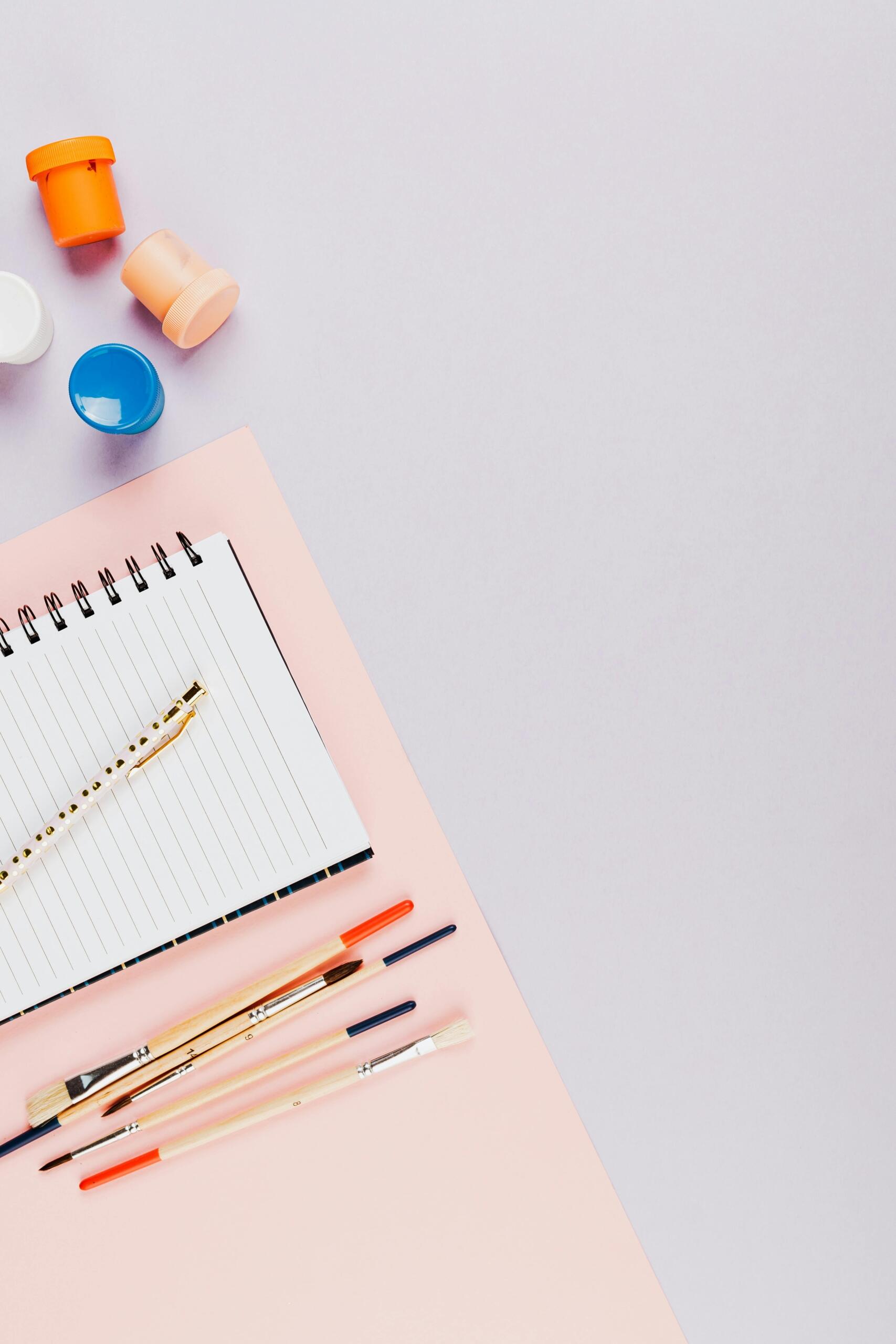 Close-up shot of school supplies on a white surface.